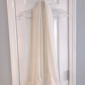 Sheer shawl perfect for weddings or formal occasions.